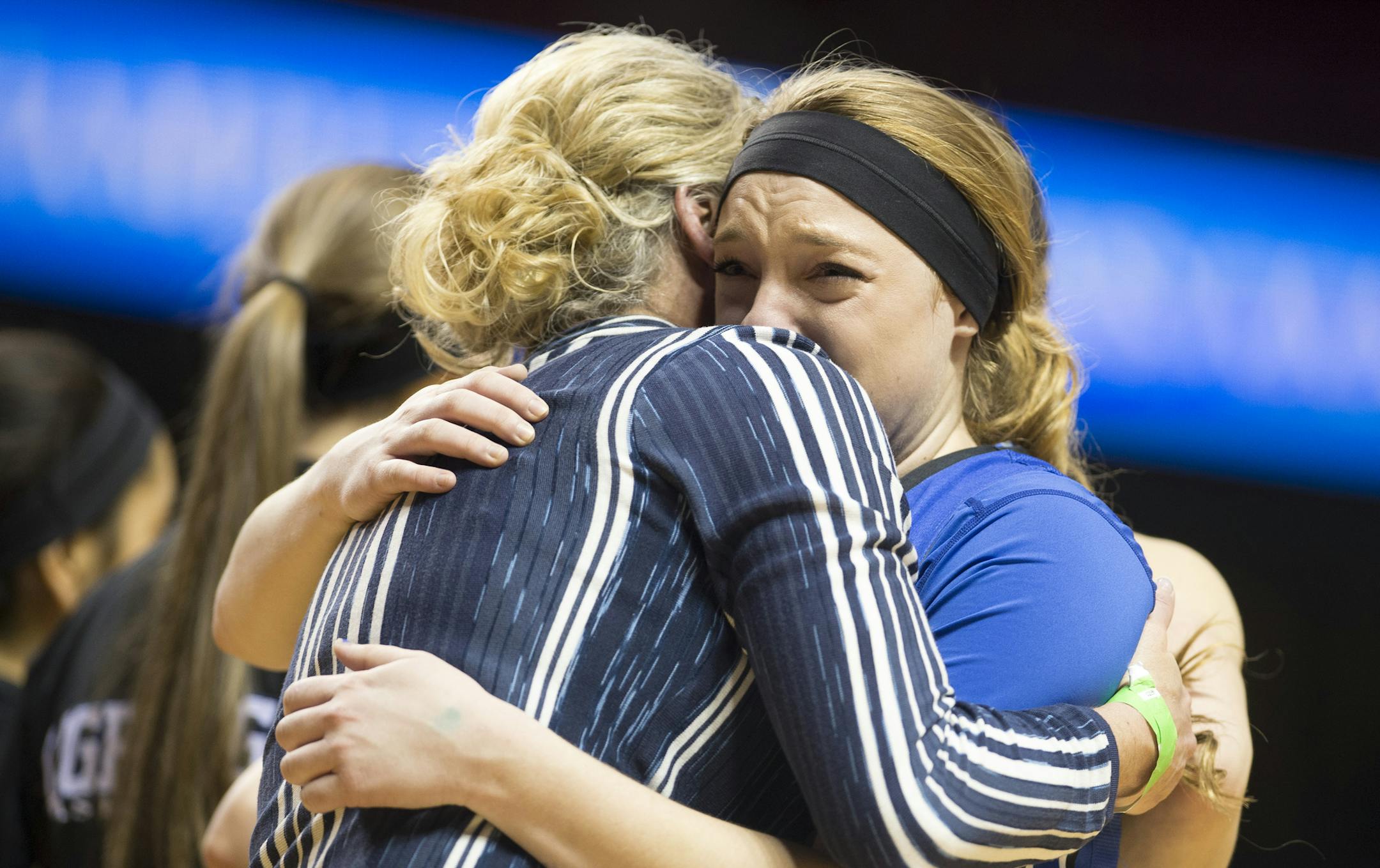 Eastview guard Madison Guebert (22) shares an emotional embrace with head coach Melissa Guebert after being defeated by Hopkins 68-60 in the Class 4A girls' championship game. ] (Aaron Lavinsky | StarTribune) Eastview plays against Hopkins in the Class 4A girls' basketball championship game on Saturday, March 21, 2015 at Williams Arena. Hopkins defeated Eastview 68-60.