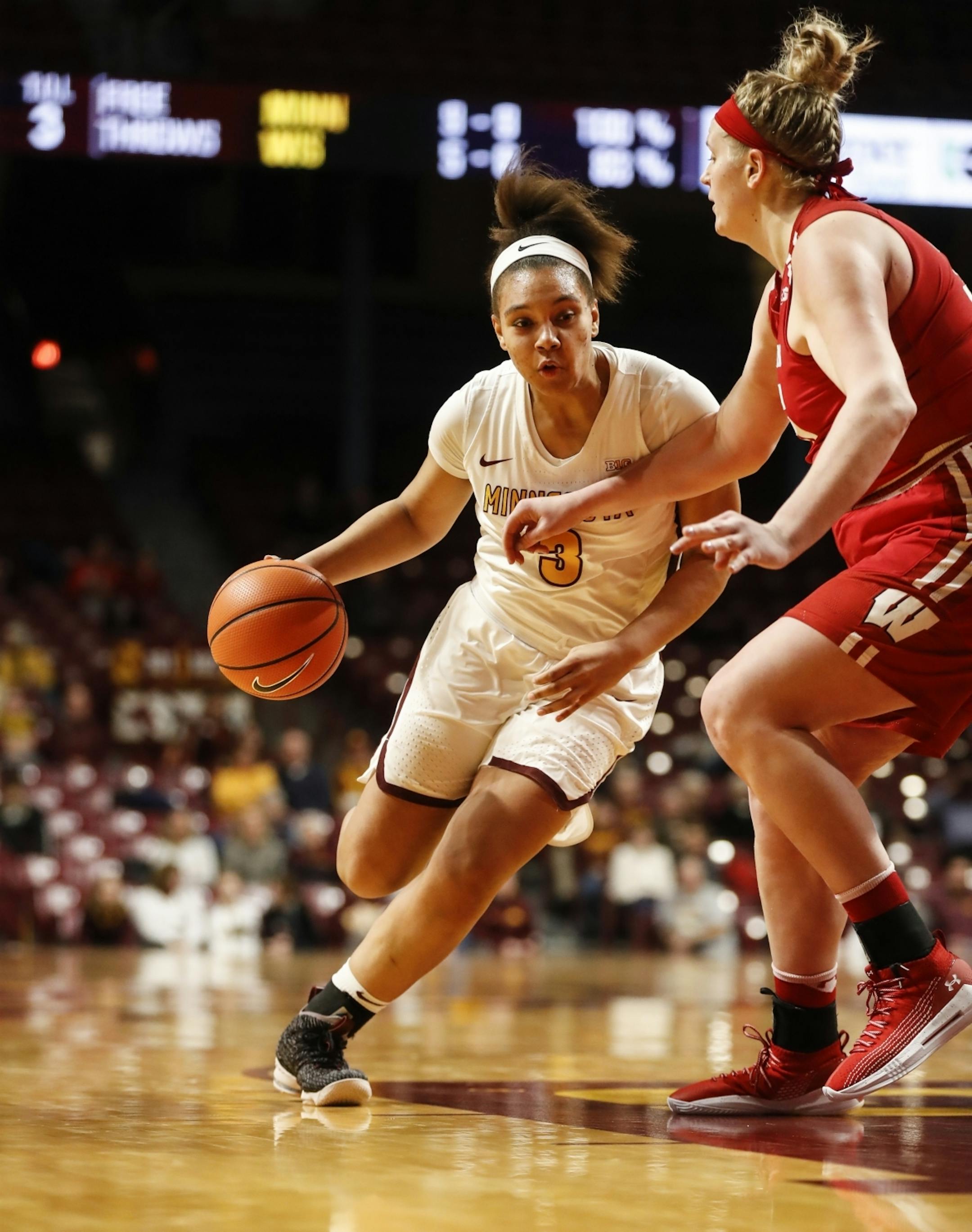 Minnesota Golden Gophers guard/forward Destiny Pitts (3) dribbled the ball around Wisconsin Badgers center Kendall Shaw (35) in the first half.