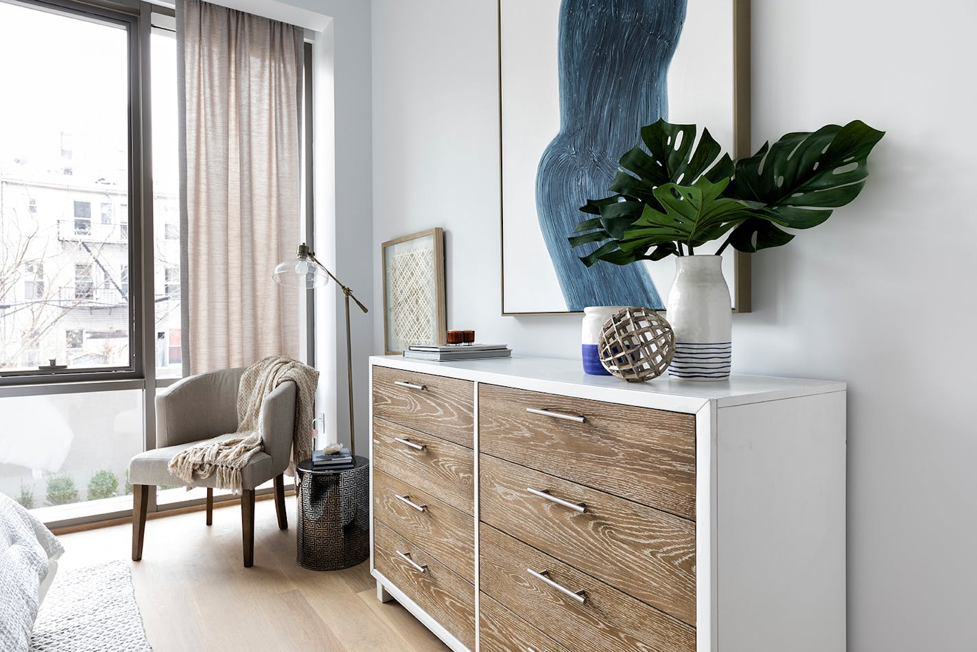 A wood dresser helps to add texture to this bedroom. (Handout/TNS)