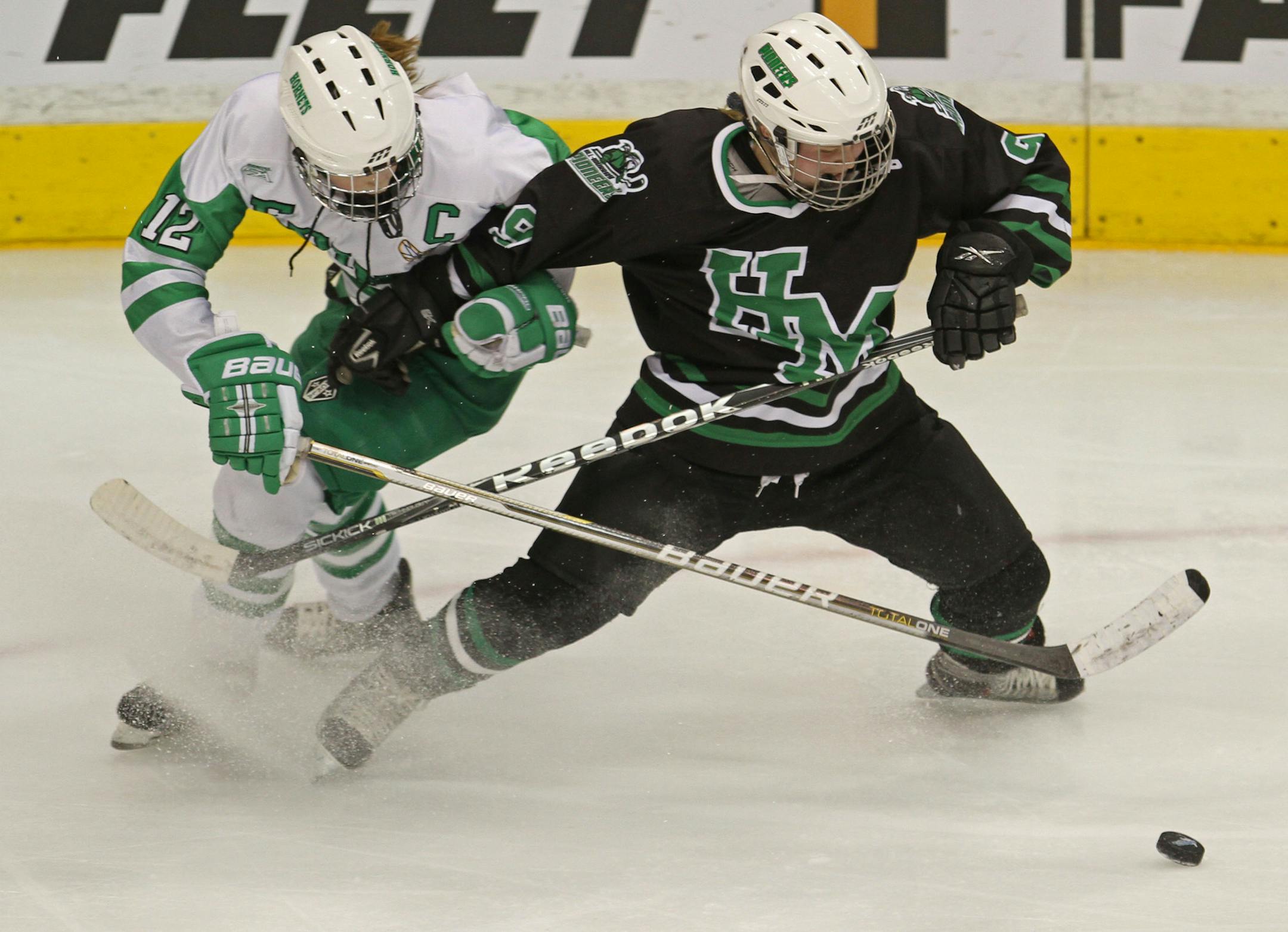 BRUCE BISPING ‚Ä¢ bbisping@startribune.com St. Paul, MN., Friday, 2/25/11] Class 2A Semifinal, Edina vs Hill Murray. (left to right) Edina's Sami Reber and Hill Murray's Brittney Anderson fought for control of the puck. ORG XMIT: MIN2013103014593254