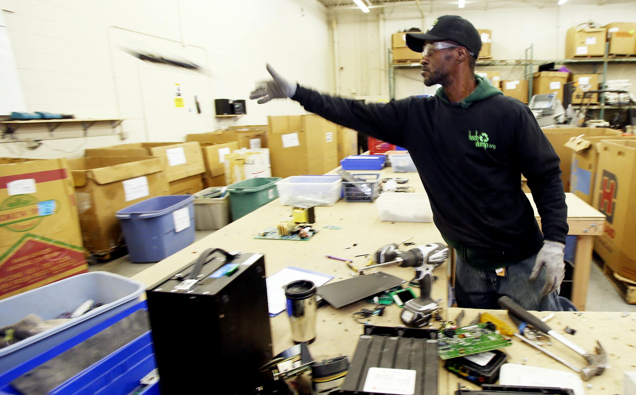 Ben Johnson disassembled a computer parts and sorted the pieces into boxes at the Tech Dump plant. ] JOELKOYAMA‚Ä¢jkoyama@startribune Golden Valley, MN on February 3, 2014. A couple of successful business guys looking to "give back," are behind a several-year-old nonprofit consumer-electronics recycling service in Golden Valley that expects this year to double the 2 million pounds of product it took in last year and double employment from 20 to 40. Tech Dump mostly hires ex-inma