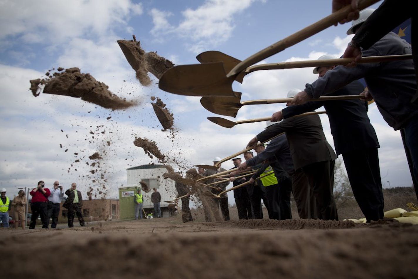 Officials broke ground during a ceremony for the construction of the Ramsey Northstar Station near Ramsey City Hall on Tuesday, March 27, 2012, in Ramsey, Minn.