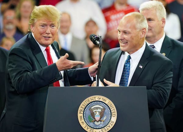 President Donald Trump welcomed Minnesota then-Congressional candidate for Pete Stauber on stage at an event in June 2018.