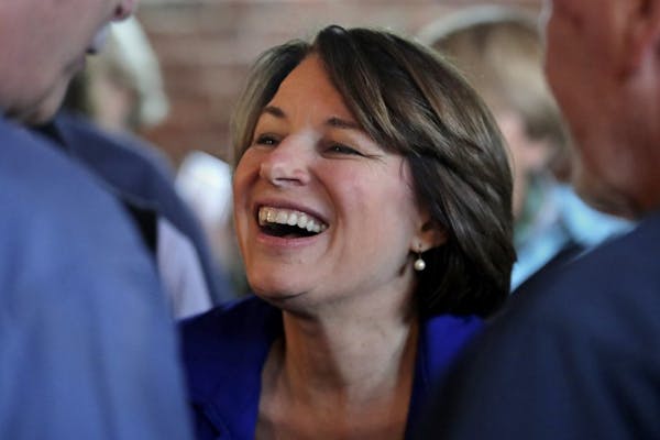 In this Oct. 17, 2019, photo, Democratic presidential candidate Sen. Amy Klobuchar, D-Minn., smiles during a campaign stop at a coffee shop in Concord
