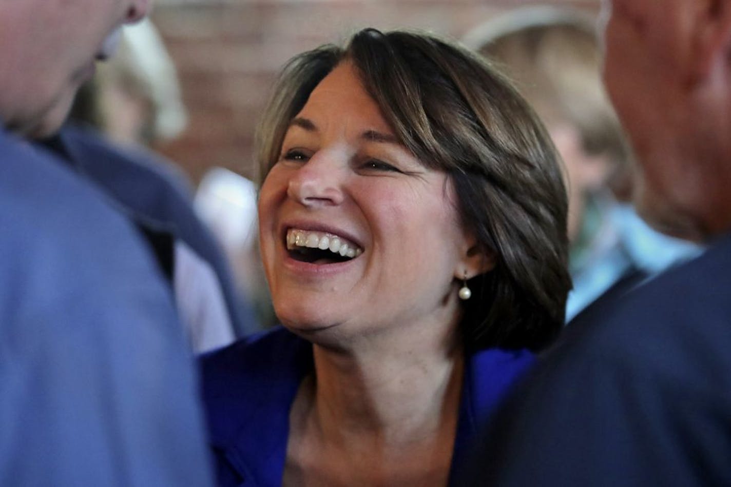 In this Oct. 17, 2019, photo, Democratic presidential candidate Sen. Amy Klobuchar, D-Minn., smiles during a campaign stop at a coffee shop in Concord, N.H.