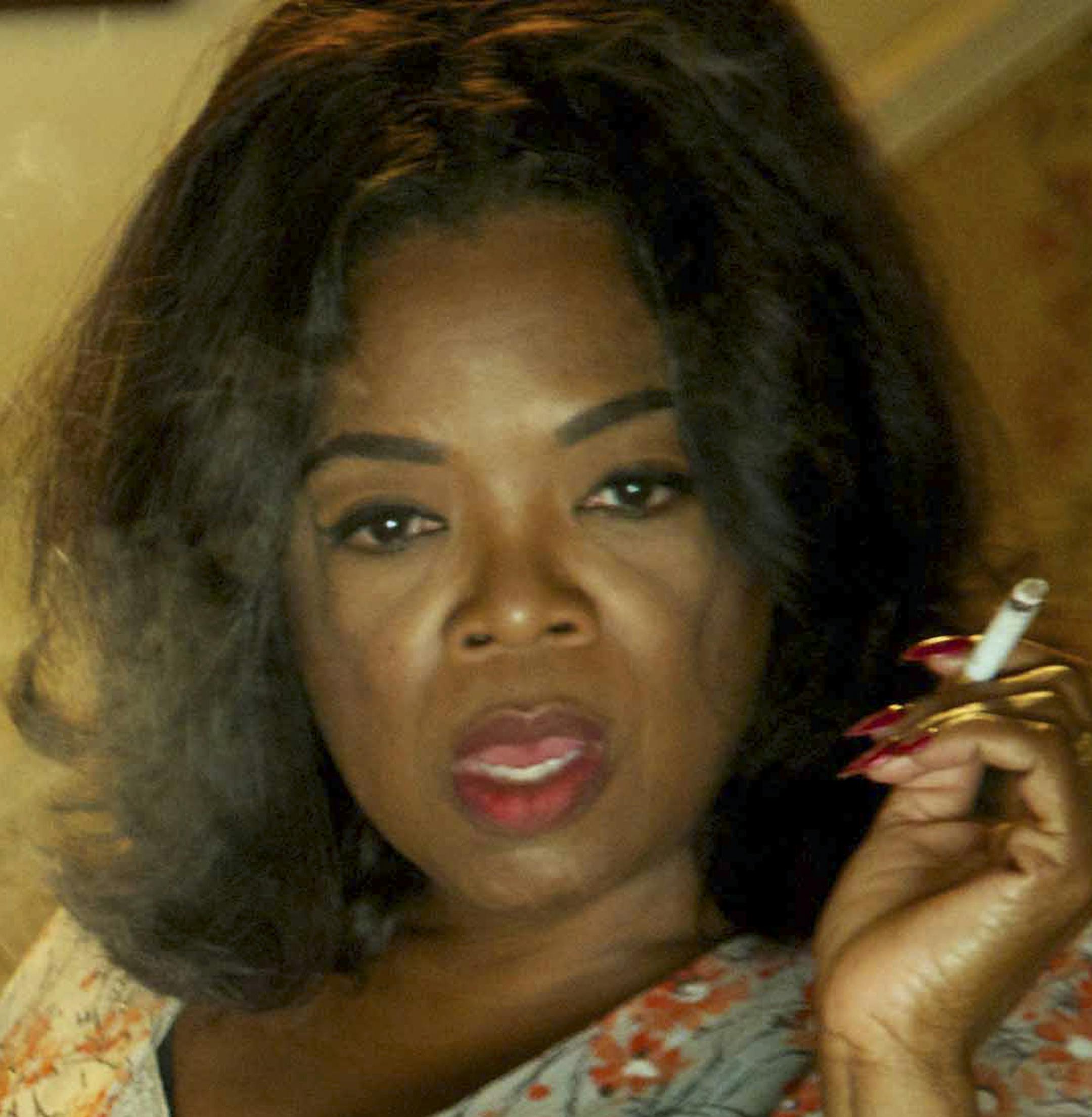 An undated handout photo of Terrance Howard and Oprah Winfrey in "The Butler," a film directed by Lee Daniels. Ruth Carter, costume designer, drew on her vintage collection of Ebony magazines, an arbiter of fashion and taste among upwardly African-Americans, to imagine how Winfrey's character as a White House butler's wife might dress throughout the civil rights movement. (Anne Marie Fox/Weinstein Company via The New York Times) -- NO SALES; FOR EDITORIAL USE ONLY WITH STORY SLUGGED FILM BUTLER