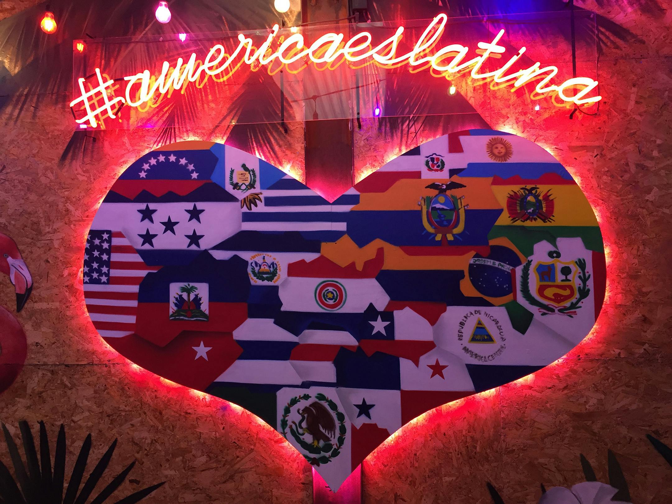 Neon murals decorate Comedor de los Milagros, Roma Sur's popular food court and bar serving international cuisines that show off Mexico City's place as a center of Latin American culture. (Ray Mark Rinaldi/Chicago Tribune/TNS)