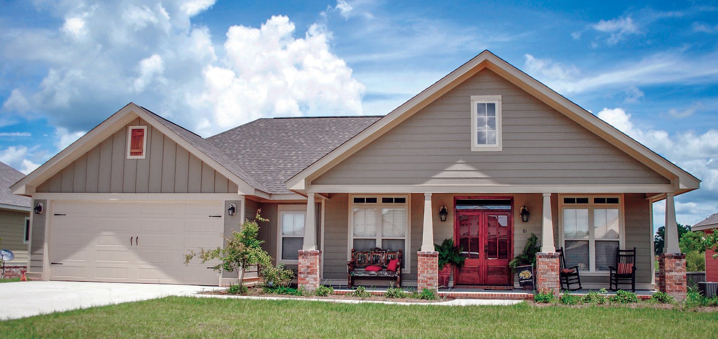 Relaxed ranch has an extra-wide porch. plan082717