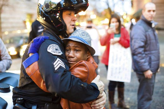 This photo of Devonte Hart, 12, went viral in 2014. He was hugging Portland police Sgt. Bret Barnum at a rally in Portland, Ore., where people had gathered in support of the protests in Ferguson, Mo.