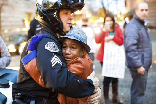 This photo of Devonte Hart, 12, went viral in 2014. He was hugging Portland police Sgt. Bret Barnum at a rally in Portland, Ore., where people had gathered in support of the protests in Ferguson, Mo.