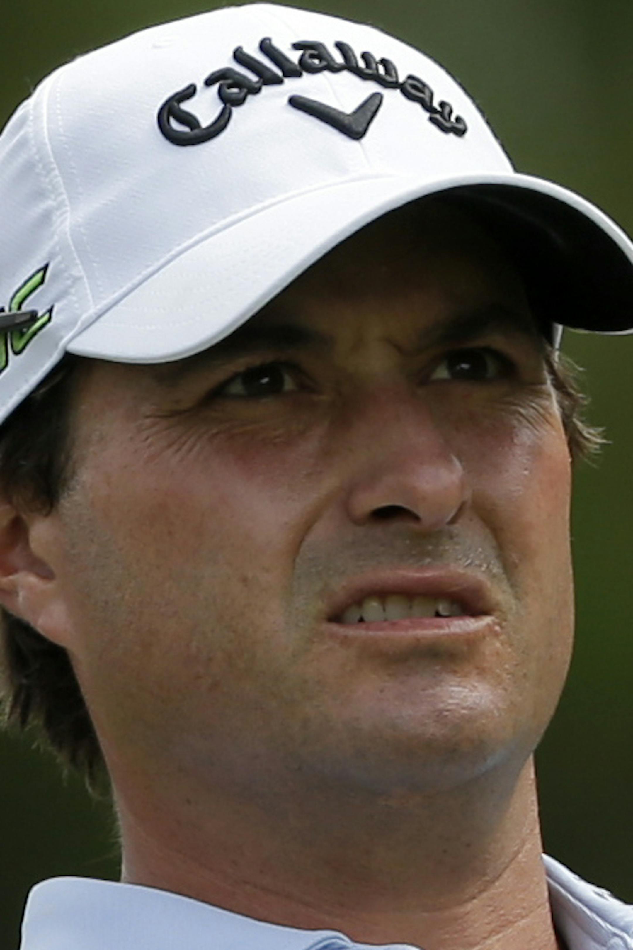 Kevin Kisner watches his tee shot on the third hole during the final round of the PGA Championship golf tournament at the Quail Hollow Club Sunday, Aug. 13, 2017, in Charlotte, N.C. (AP Photo/Chuck Burton) ORG XMIT: PGA1