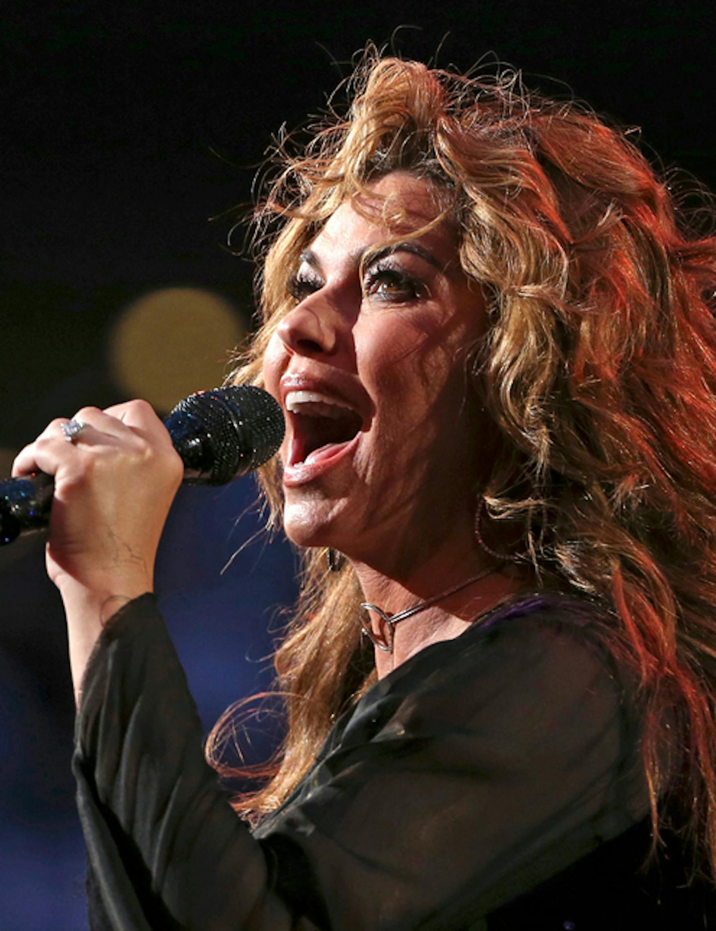 FILE - In this Aug. 28, 2017, file photo, Shania Twain performs during opening ceremonies for the U.S. Open tennis tournament in New York. Twain has apologized for saying if she were American she would have voted for Donald Trump for president, even though he's offensive. She made the comments in an interview with The Guardian that was published over the weekend. She told the British newspaper "Do you want straight or polite? &#x2026; I would have voted for a feeling that is transparent." (AP Ph