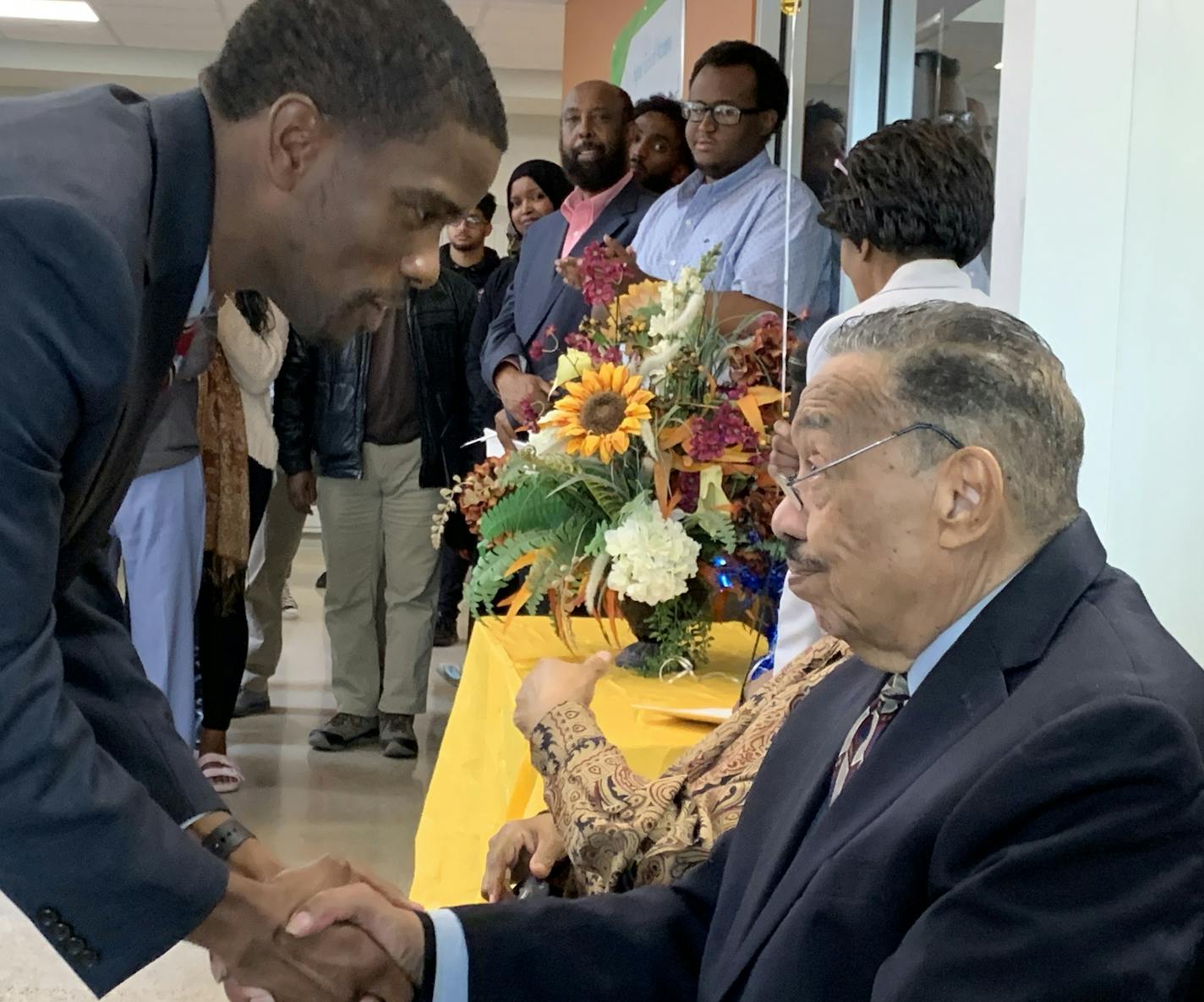 St. Paul Mayor Melvin Carter, left, said Bill Wilson, former council member and council president, spent his life in service to others and paved the way for his own public service.