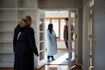 Libby Jacobson and Kyle Staunton walk through their new house with real estate agent Kathy Borys, left, in St. Anthony, the third-hottest city in the 