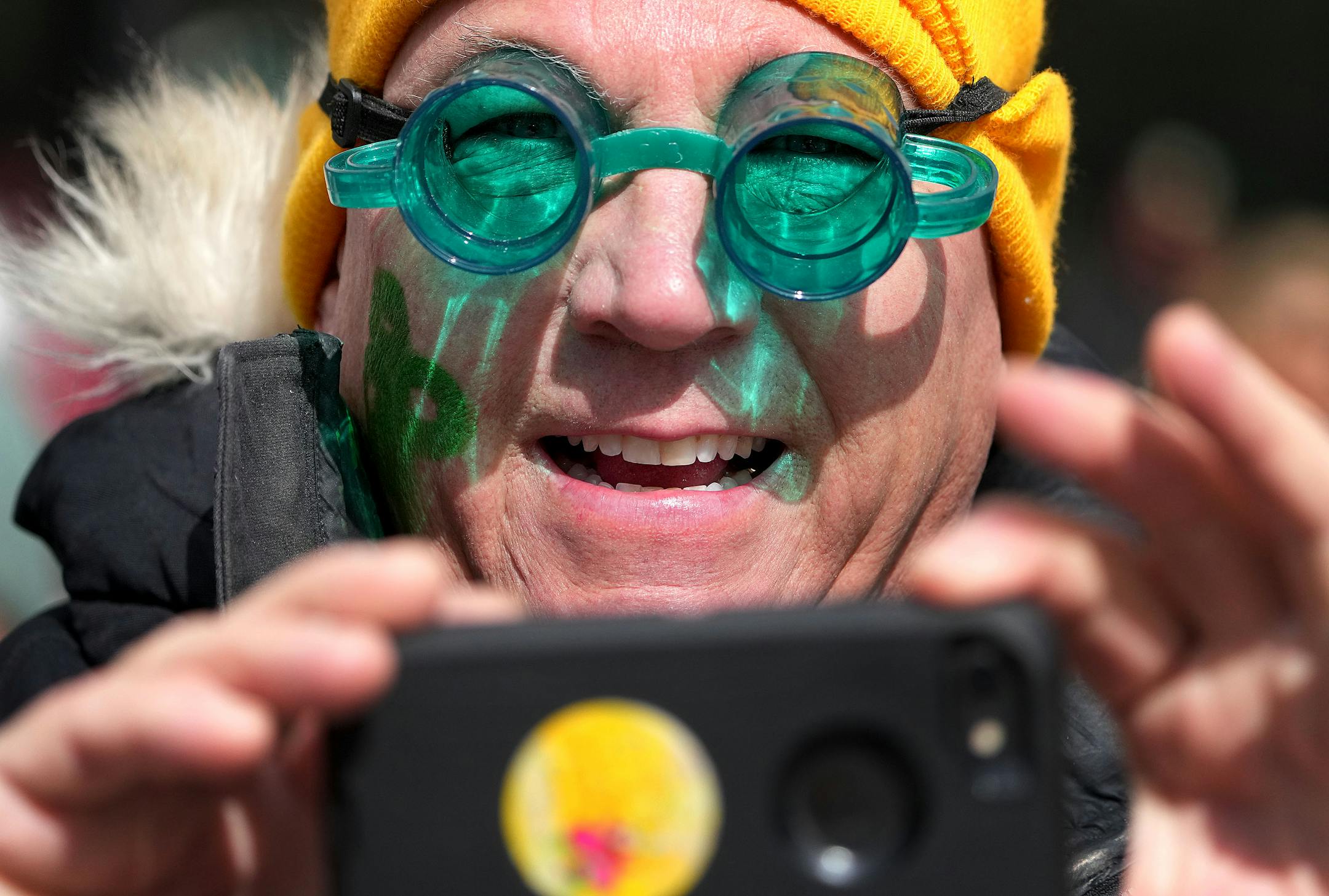 Dave Williams of White Bear Lake wore dual purpose glasses during St. Paul's St. Patrick's Day parade.