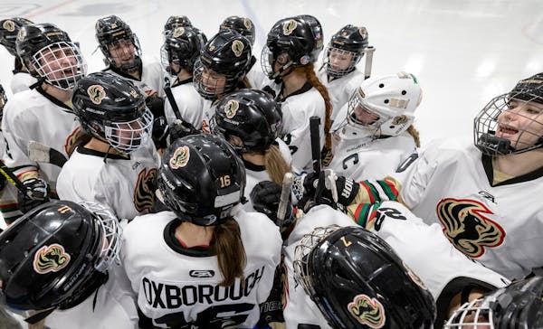 The Metro - South Phoenix girls hockey team huddled up between periods Tuesday, Jan. 24, 2023, at Drake Ice Arena in St. Paul, Minn. ] CARLOS GONZALEZ