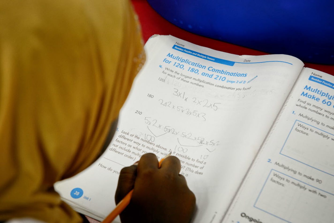 A fifth-grader worked on multiplication workbooks at Global Academy, a charter school in Columbia Heights.