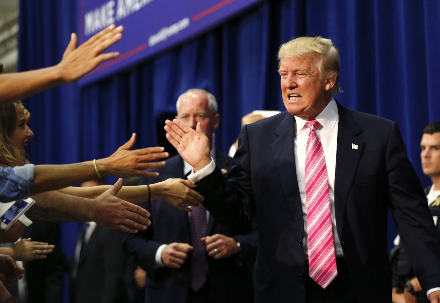 Donald Trump high-fived supporters in the crowd as he arrived at a campaign rally in Fredericksburg, Va., on Saturday.