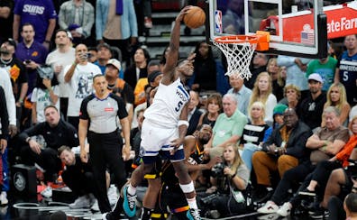 Wolves guard Anthony Edwards puts the finishing touches on the Suns and Kevin Durant by dunking late in the fourth quarter Sunday night in Phoenix.