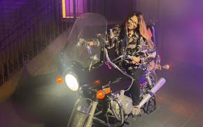 Tyka Nelson sits on one of Prince's motorcycles