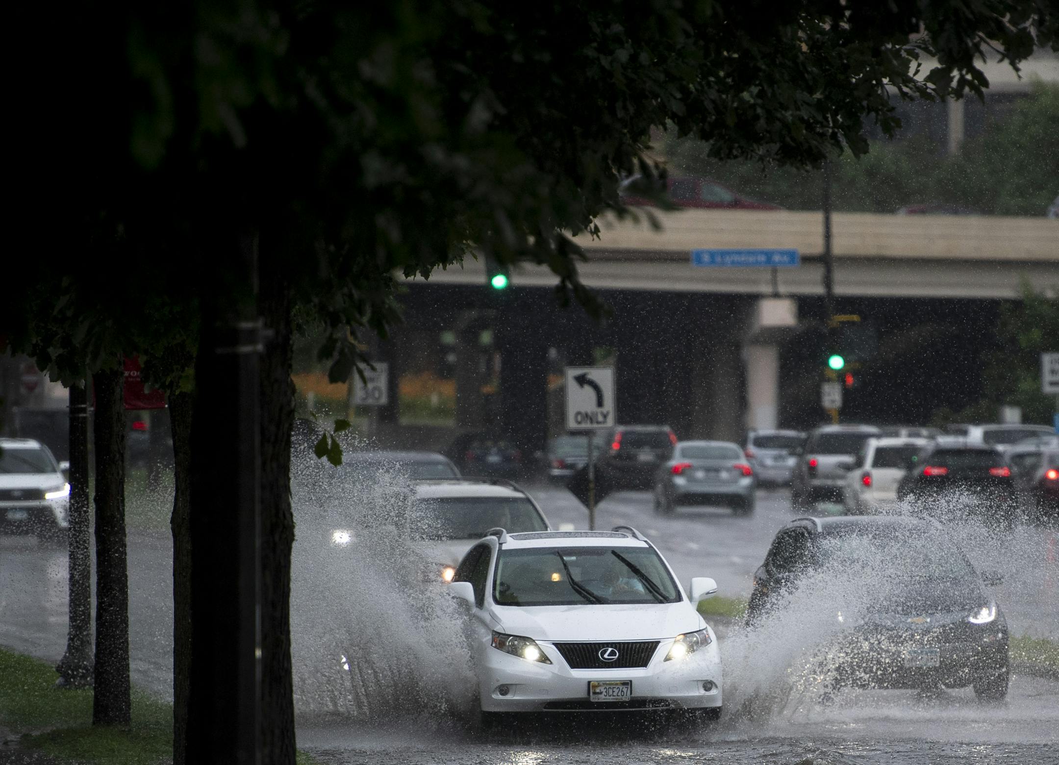 Motorists drove through flash flooding along Dunwoody Boulevard near Lyndale Avenue South during Tuesday's rainy evening commute.