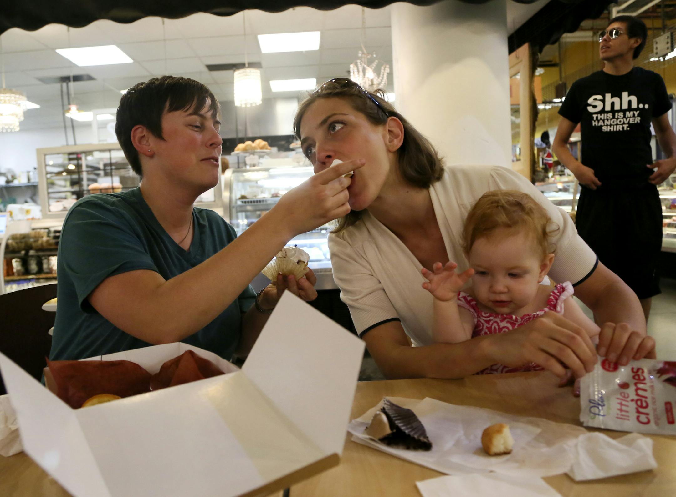 Amy Theis, 34, right, and her partner Nichol DePoint and their daughter Hattie, 1, shopped for cupcakes at the Salty Tart Bakery in the Midtown Global Market Friday, June 14, 2013, for their upcoming Aug. 9 wedding, 2013, in Minneapolis, MN.](DAVID JOLES/STARTRIBUNE) djoles@startribune.com Amy Theis, 34, and Nichol DePoint, 35, will be among dozens of same-sex couples in Minnesota getting married in August. "We're human too," DePoint said about the right for all to get married. "I wouldn't take