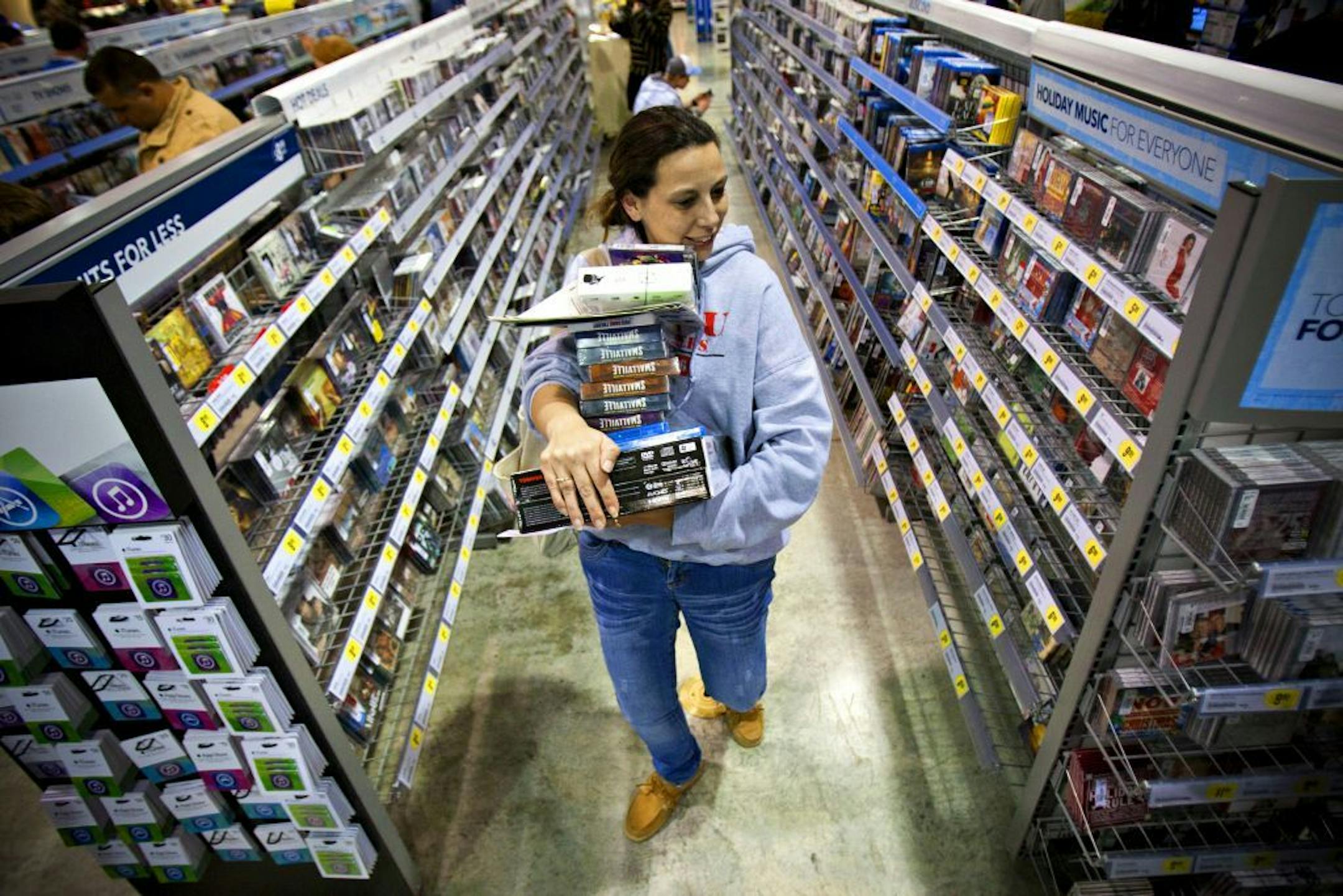 FILE -In this Friday, Nov. 23, 2012, file photo, Tonya Thomas, of Russellville, Ky., makes her way through the aisles at Best Buy in Bowling Green, Ky. U.S. consumer confidence rose this month to its highest level in almost five years, helped by a better outlook for hiring over the next six months. The Conference Board said Tuesday, Nov. 27, 2012, that its consumer confidence index rose to 73.7 in November from 73.1 in October. Both are the best readings since February 2008.