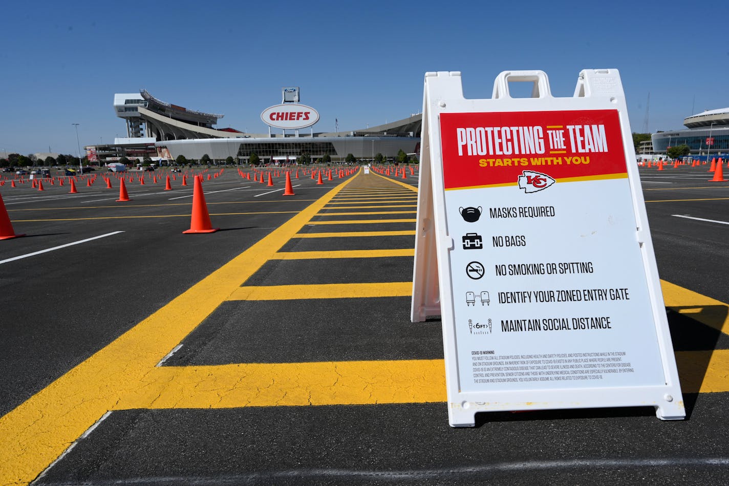 Arrowhead Stadium has warnings out to help protect both the fans and players for an NFL football game between the Kansas City Chiefs and the New England Patriots, Monday, Oct. 5, 2020, in Kansas City, Mo. (AP Photo/Reed Hoffmann)