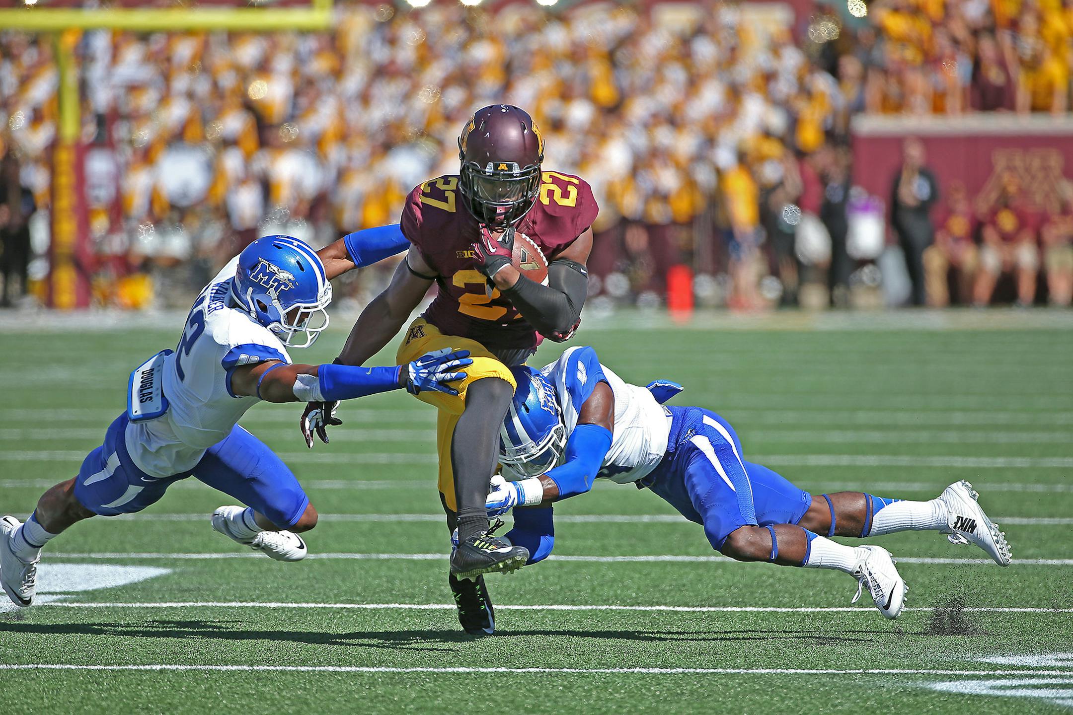 Minnesota senior running back David Cobb plowed through a Middle Tennessee defense for a 15 yard run during the first quarter as the Minnesota Gophers took on Middle Tennessee at TCF Bank Stadium, Saturday, September 6, 2014 in Minneapolis, MN. ] (ELIZABETH FLORES/STAR TRIBUNE) ELIZABETH FLORES � eflores@startribune.com