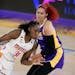 Washington Mystics center Tina Charles (31) is defended by Los Angeles Sparks center Amanda Zahui B during the first half of a WNBA basketball game Th