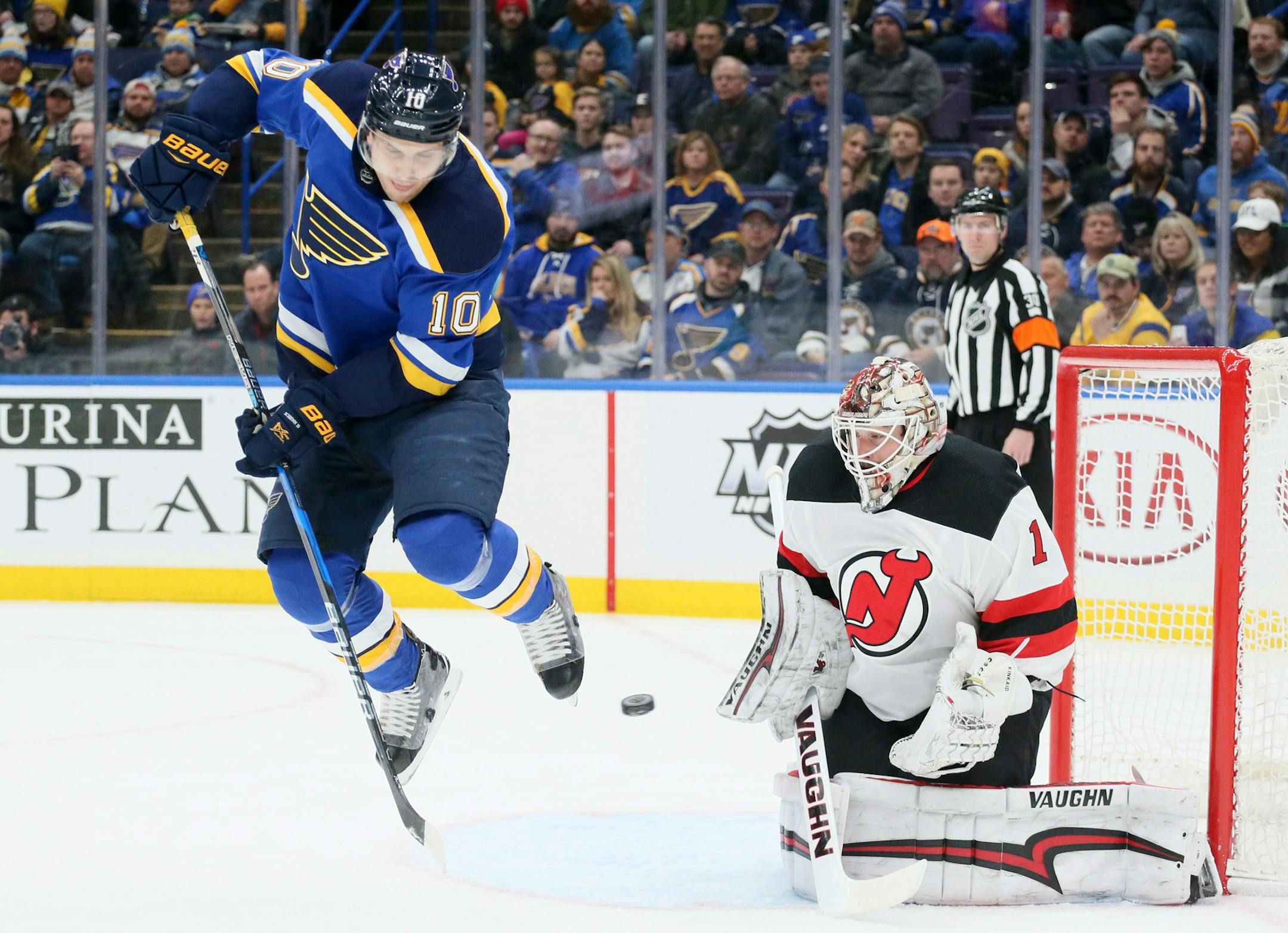 The St. Louis Blues' Brayden Schenn hops clear of a teammate's shot against New Jersey Devils goaltender Keith Kinkaid in the first period on Tuesday, Jan. 2, 2018, at the Scottrade Center in St. Louis. The Blues won, 3-2, in a shootout. (Chris Lee/St. Louis Post-Dispatch/TNS) ORG XMIT: 1220077