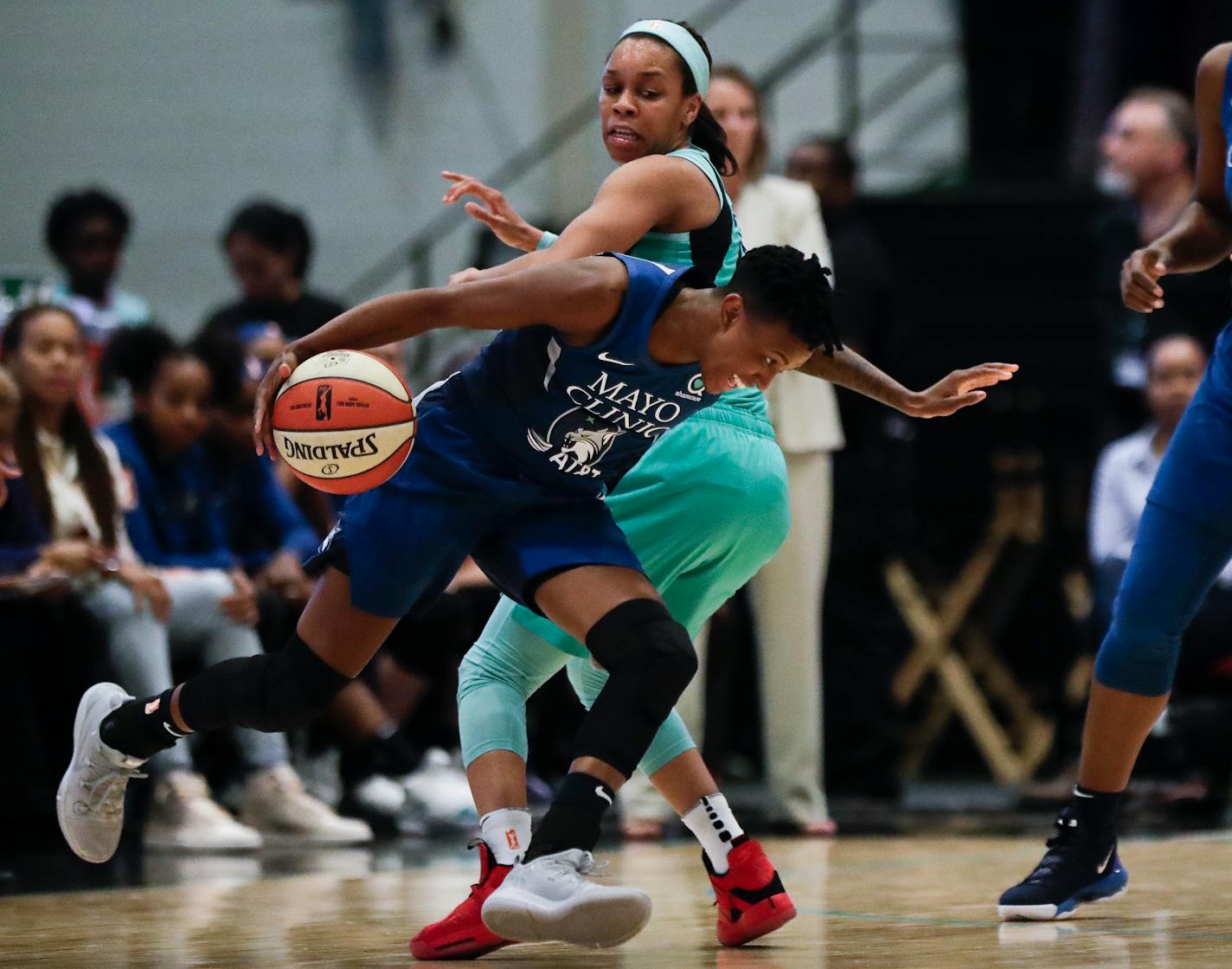 Minnesota Lynx's Danielle Robinson, front, drives past New York Liberty's Asia Durr during the first half of a WNBA basketball game Wednesday, June 12, 2019, in White Plains, N.Y. The Liberty won 75-69. (AP Photo/Frank Franklin II)