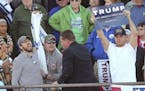 FILE - In this Feb. 28, 2016, file photo, protesters are removed from a rally hosted by Republican presidential candidate Donald Trump in Madison, Ala