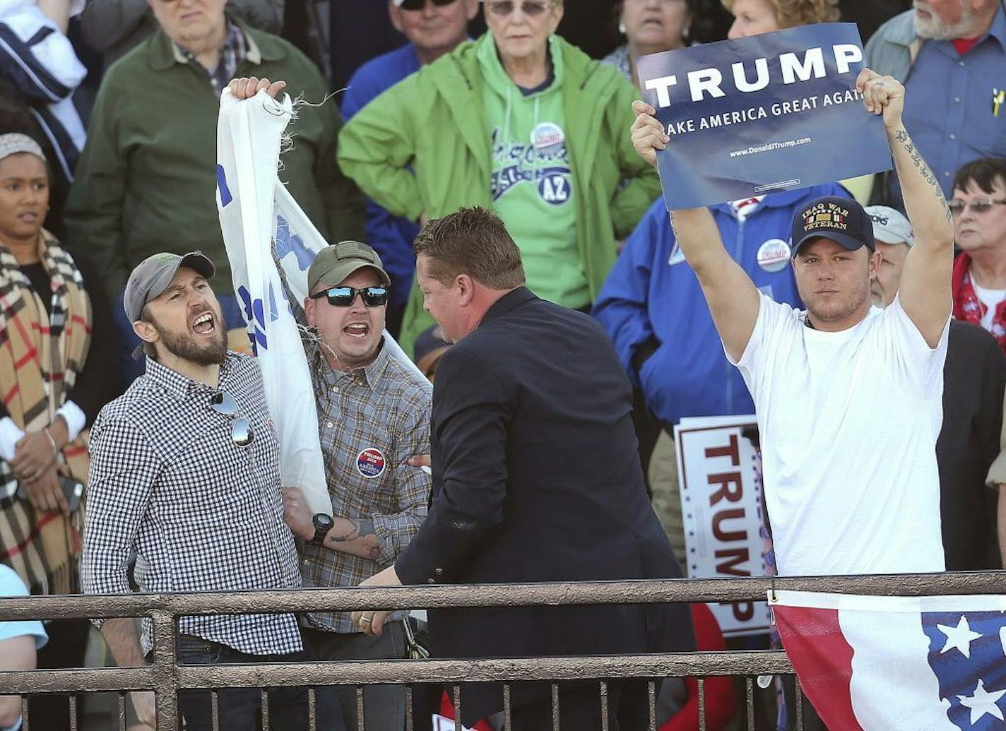 FILE - In this Feb. 28, 2016, file photo, protesters are removed from a rally hosted by Republican presidential candidate Donald Trump in Madison, Ala. Massive rallies are the hallmark of Trump�s unusual presidential campaign, and protesters, along with Trump�s reaction to them, have become a defining characteristic of the tense, sometimes racially charged affairs