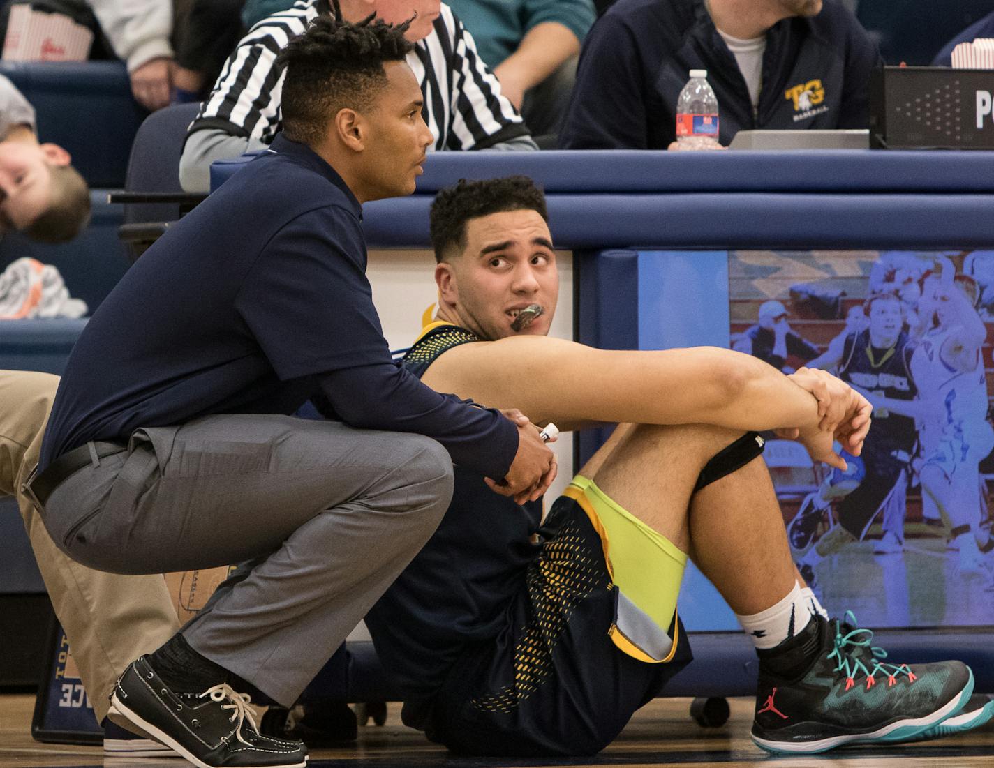 Totino-Grace head coach Robert Ware gives instructions to Totino-Grace center Lewis Kidd (44) as the Totino-Grace Eagles hosted the Spring Lake Park Panthers on January 29, 2016 in Fridley, Minnesota. ] Special to Star Tribune MATT BLEWETT &#xef; matt@mattebphoto.com - January 29, 2016, Fridley, MN, Totino-Grace Eagles, Spring Lake Park Panthers, MSHSL Boys Basketball, 310037 PNORTH 021416