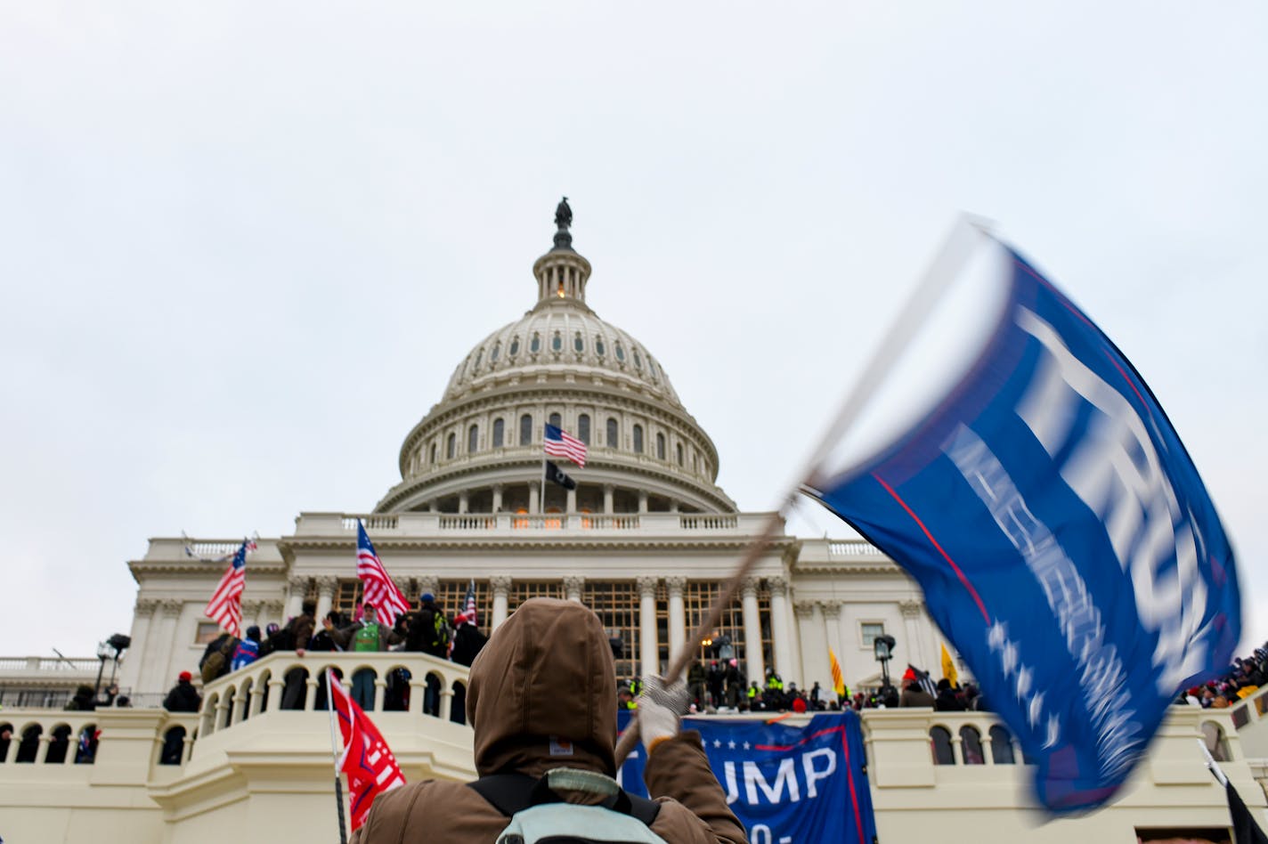 A mob of President Donald Trump's supporters storm the Capitol building in Washington, Jan. 6, 2021.