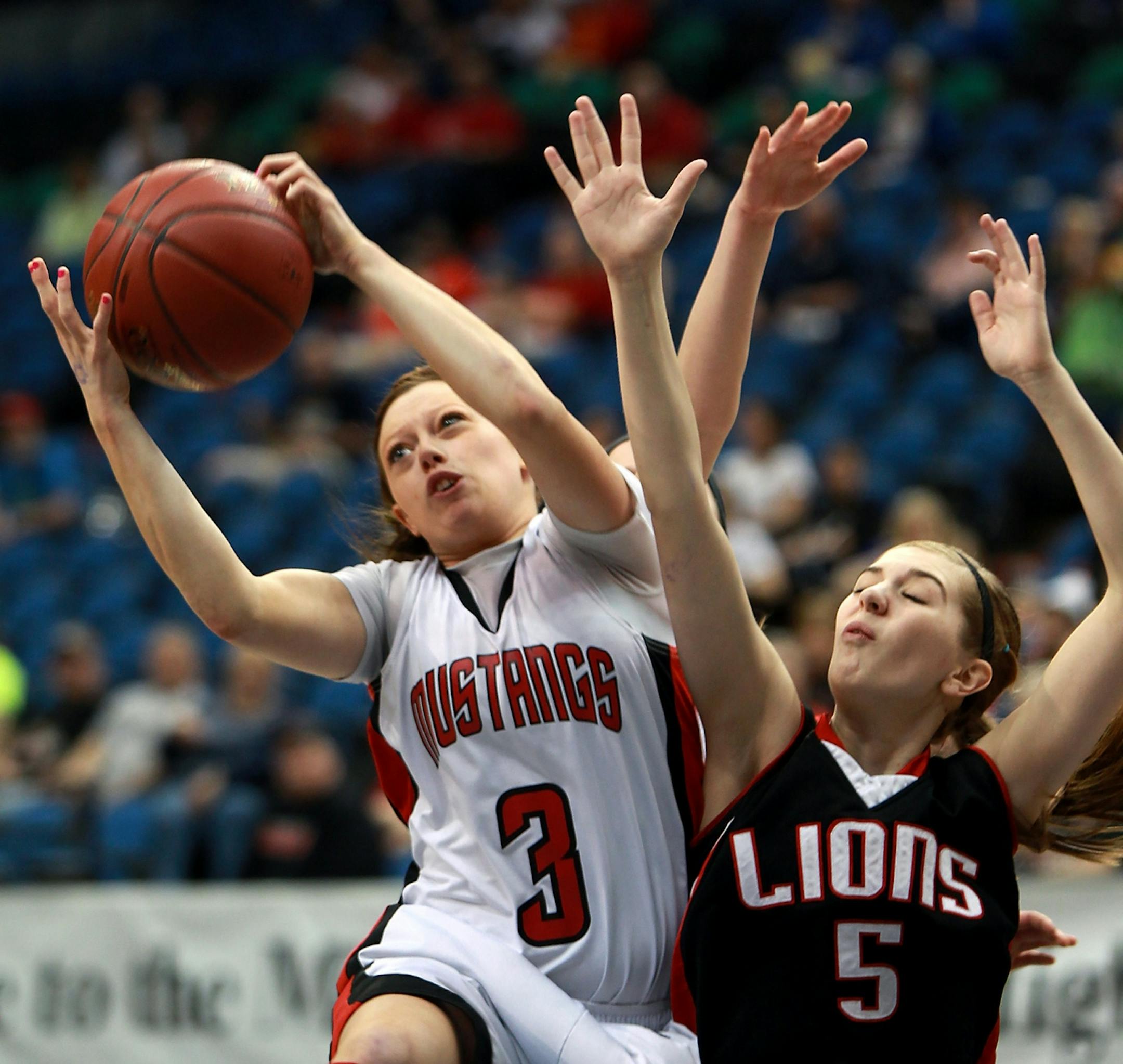 Maranatha Christian Academy's Abby Torgerson and Spring Grove's Randi Mehus battled for possession during the first half of the Class 1A girls' basketball semifinals at the Target Center, Friday, March 16, 2012 . ELIZABETH FLORES/STAR TRIBUNE) ELIZABETH FLORES � eflores@startribune.com