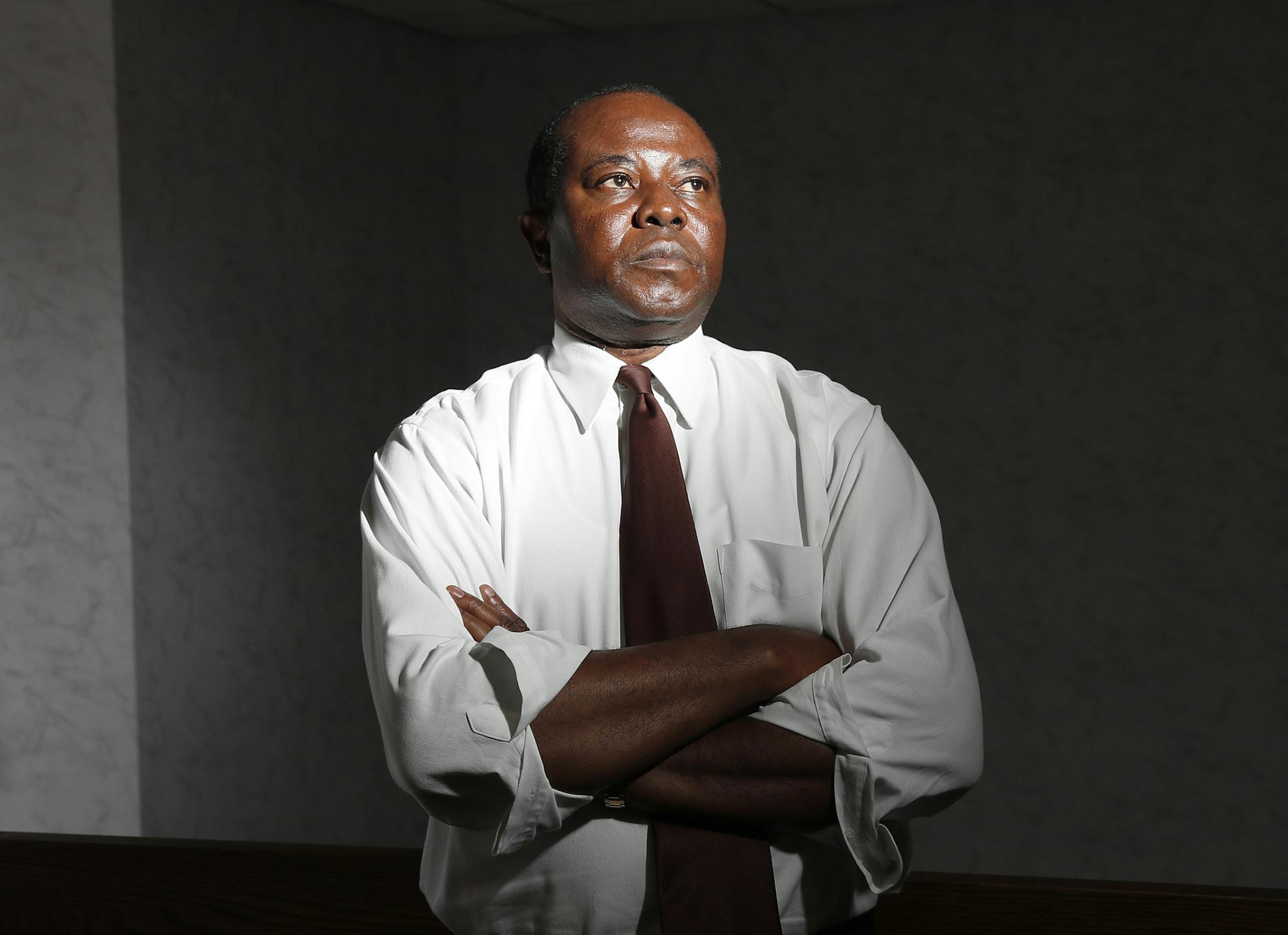Rev. Philip Jegede is suing the local Better Business Bureau for giving his online seminary an "F" rating, which he said is seriously hurting the seminary's business. ] CARLOS GONZALEZ cgonzalez@startribune.com - June 13, 2016, Columbia Heights, MN, The Rev. Philip Jegede sues the local Better Business Bureau for giving his online seminary an "F" rating, which he said is seriously hurting the seminary's business.
