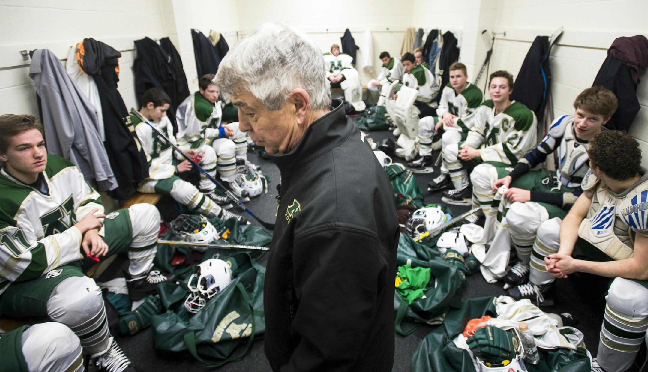 Mayo boys hockey head coach Lorne Grosso visited his team in the locker room before the start of their mid-December game against Albert Lea. (Aaron Lavinsky, Star Tribune)