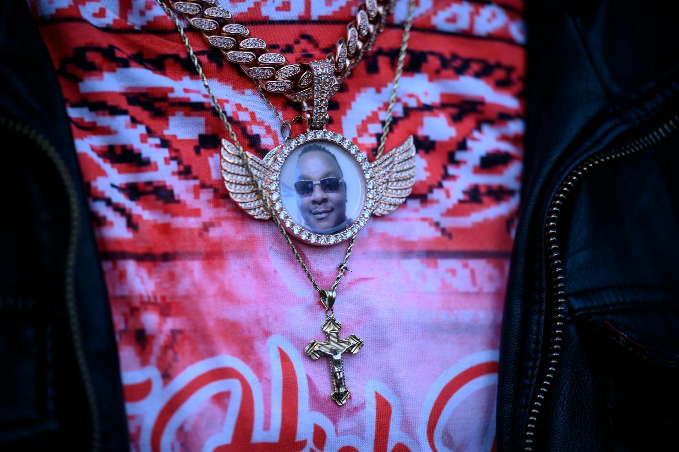 A photo of Leneal Frazier on his brother Orlando's necklace during a news conference outside Minneapolis City Hall Tuesday, Nov. 9, 2021 in Minneapolis, Minn. Leneal Frazier. Minneapolis police officer Brian Cummings made his first appearance in court via zoom Tuesday for striking a vehicle and killing the driver, Leneal Frazier, during a pursuit through in July, 2021. ] AARON LAVINSKY • aaron.lavinsky@startribune.com