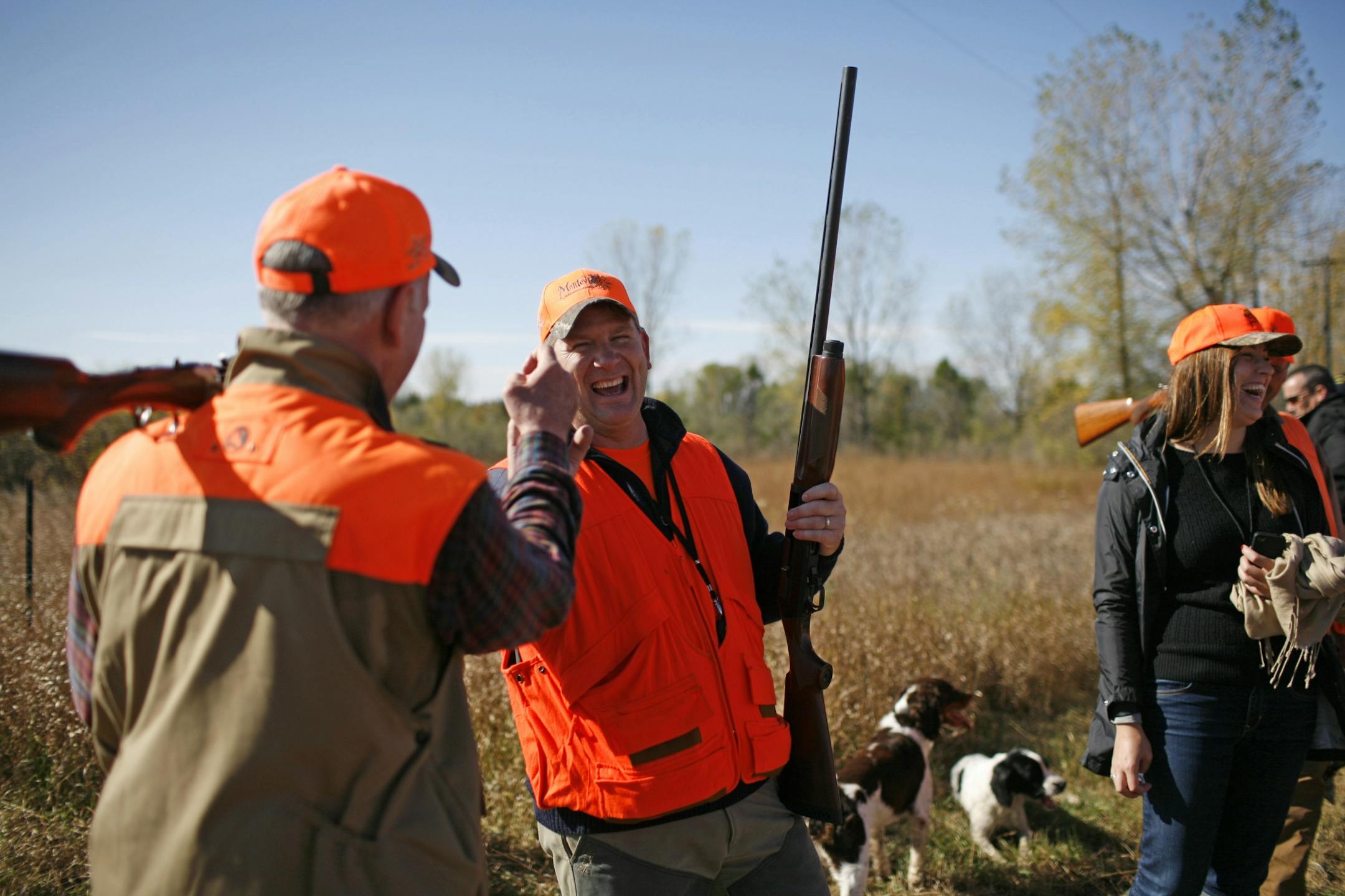 Gov. Dayton and Kurt Zellers congratulated one another on a good mornings hunt. Gov. Mark Dayton, left, pointed out to Speaker of the house Kurt Zellers that they were both in the same party this morning (i.e. same hunting party). Gov. Mark Dayton's party hunted in Lac Qui Parle Saturday morning. IT is the first governors pheasant opener. At right is the governor's press spokesperson, Kate Tinucci.