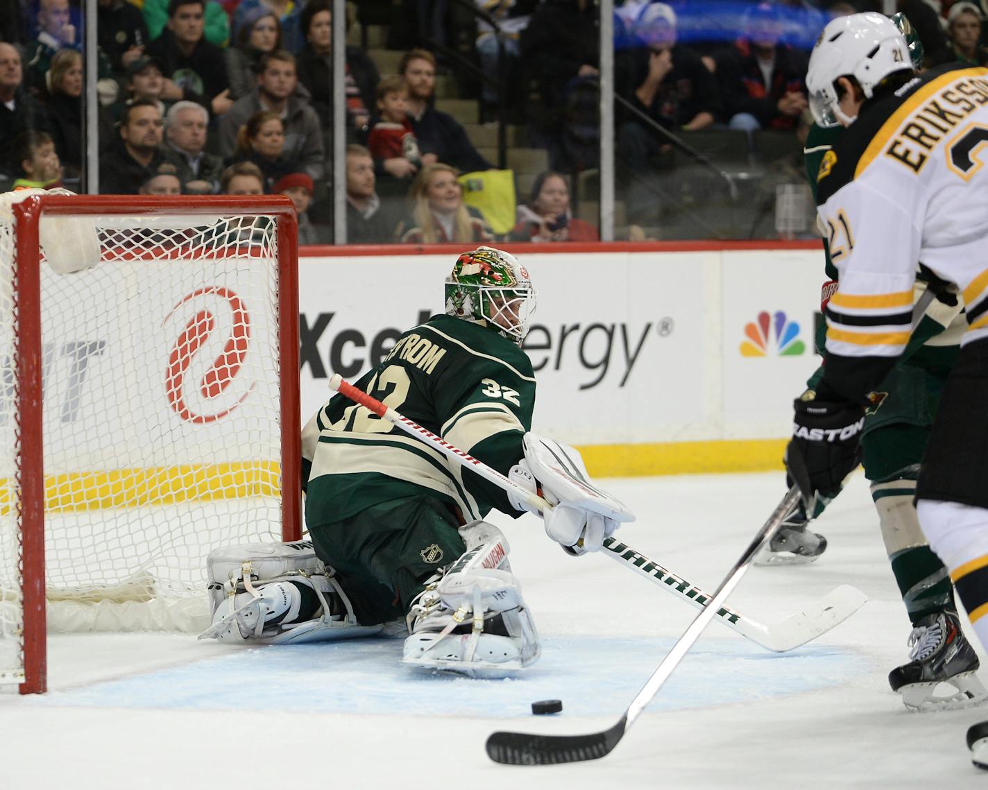 Boston Bruins left wing Loui Eriksson (21) serves up a game-winning goal from behind the back of Minnesota Wild goalie Niklas Backstrom (32) in overtime Wednesday night. ] AARON LAVINSKY � aaron.lavinsky@startribune.com The Minnesota Wild take on the Boston Bruins Wednesday, Dec. 17, 2014 at Xcel Energy Center in St. Paul.