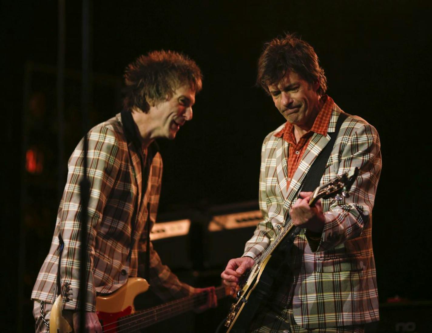 Tommy Stinson, left, and Paul Westerberg of The Replacements clearly seemed to be enjoying themselves during their set at Midway Stadium Saturday evening.