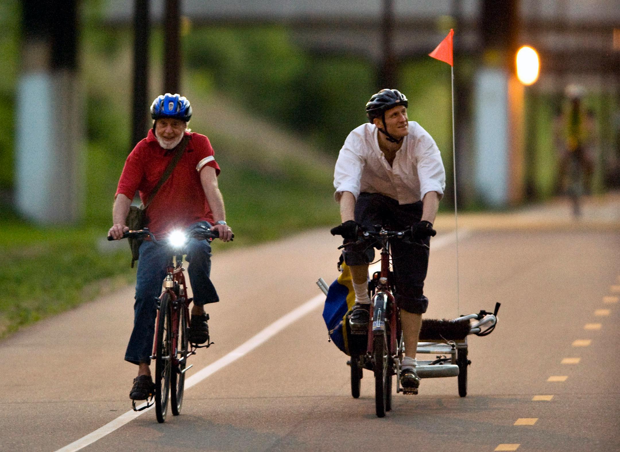 Paul Caspersen and Mark Ambroe ride on night patrol on the Midtown Greenway in June 2013.