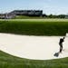 Rory McIlroy, of Northern Ireland, hits out of the bunker on the 17th hole during a practice round for the U.S. Open golf championship at Oakmont Coun