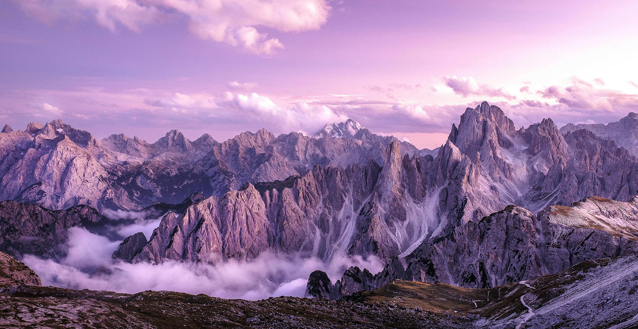The photo was taken in the Dolomites in Northern Italy, in the Tre Come di Lavaredo natural Park. The park is a short drive from the town of Cortina d'Ampezzo which we used as a base to explore the Eastern portion of the mountain range, a town filled with hikers in the summer and skiers in the winter. The hotel was very comfortable, best of all there was NO TV and limited WiFi. (The last thing I want on vacation is to come into the hotel see CNN on the tube!! ) The region is spectacular for both