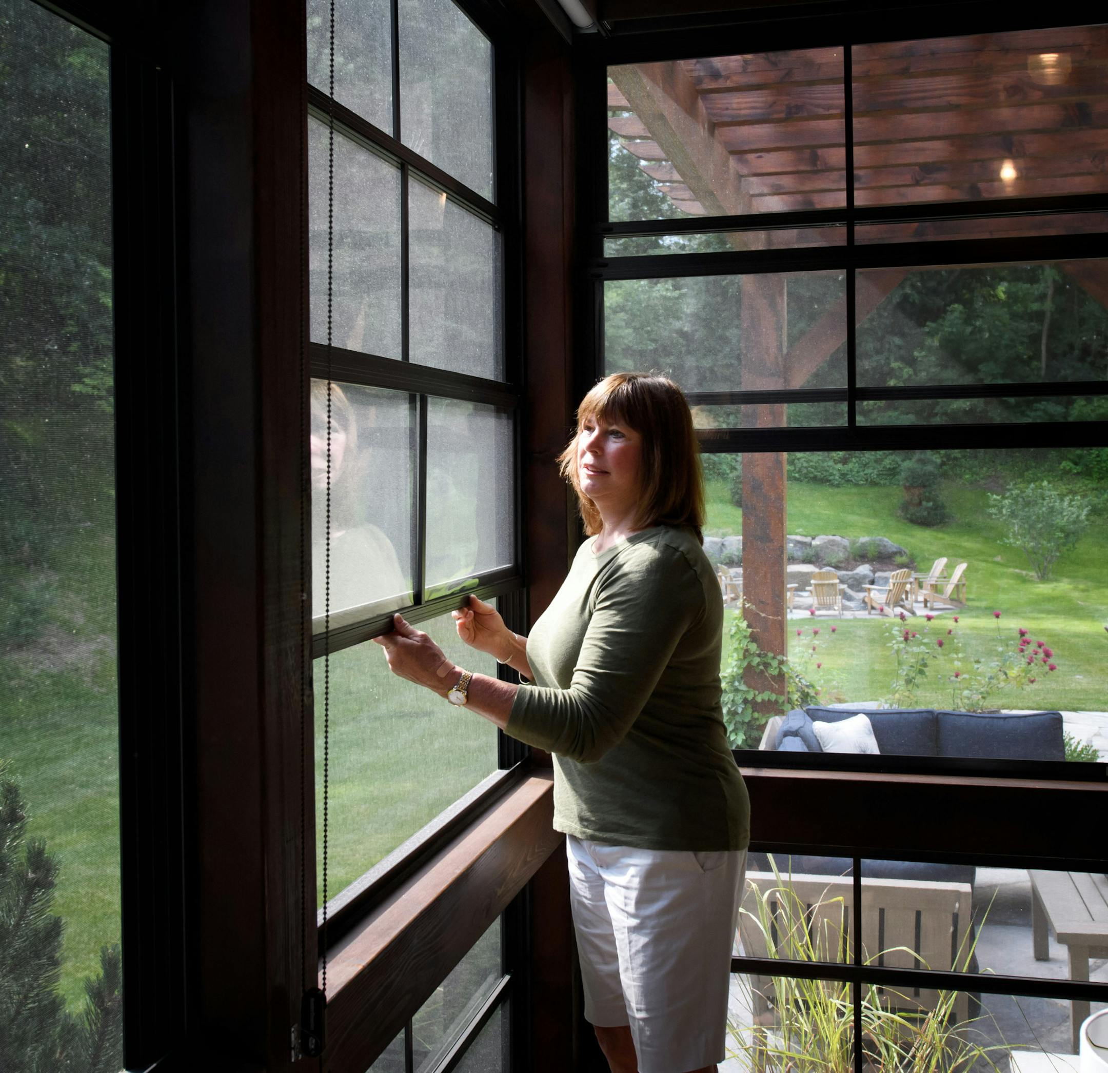 Jackie Chase showed easy lift screen windows on the back porch. ] GLEN STUBBE * gstubbe@startribune.com Wednesday, July 13, 2016 266246 Upsizing for grandkids. Empty-nester Jackie Chase built a bigger, kid-friendly house in Mendota Heights as a magnet for her grandkids.