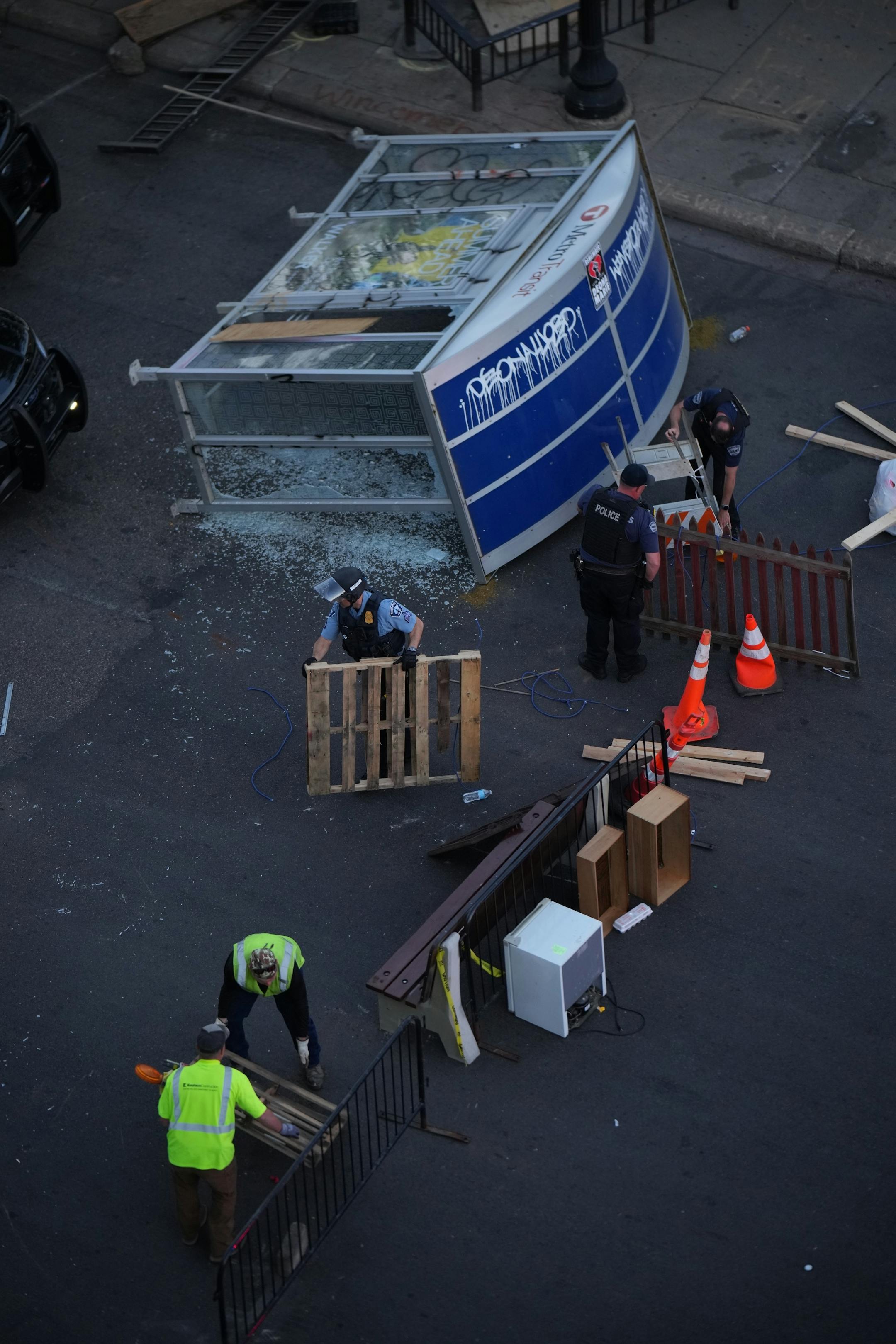 Minneapolis Police descended on the block long stretch of Lake St. in Uptown just before sunset Tuesday night, June 15, 2021 to dismantle the barricades erected by protesters.