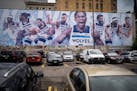 A giant mural of the Timberwolves hangs in the parking lot on the Gluek's building in downtown Minneapolis on Tuesday.