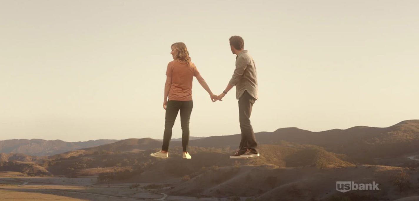 A couple walks on the imagined porch of their new home in a commercial for US Bank as part of its new branding campaign. Courtesy USBancorp.